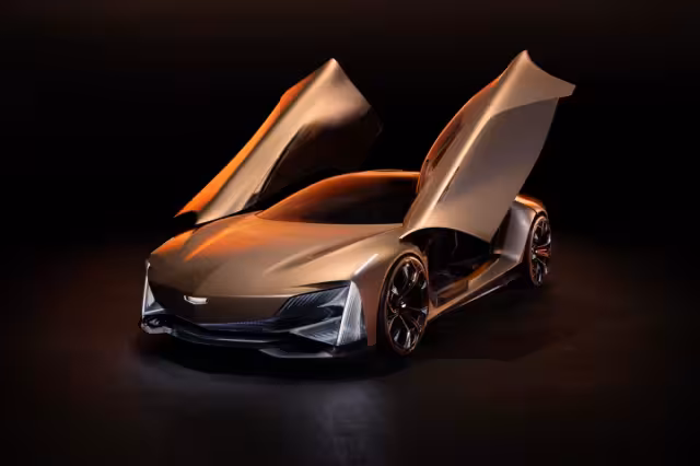 Zlatavý koncept Cadillac Opulent Velocity s otevřenými motýlími dveřmi