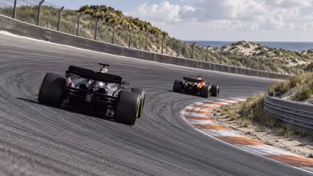 Generovaná ilustrace závodní stopy a vozu na okruhu Zandvoort.