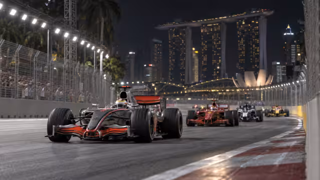 Generovaná historická scéna z počátků závodů na okruhu Marina Bay.